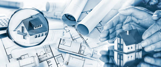 istock Houses with magnifying glass, hands and building plans 866522350