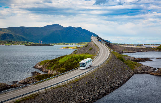 Tourist bus traveling on the road in Norway stock photo