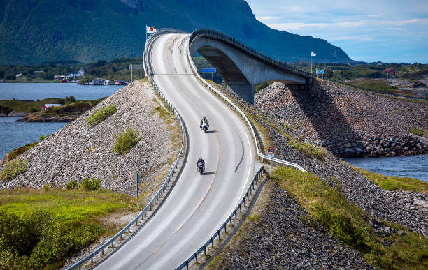 istock Atlantic Ocean Road Two bikers on motorcycles. 866522686