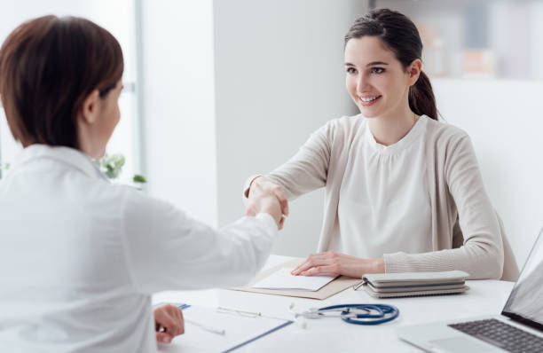 istock Doctor and patient shaking hands 866523366