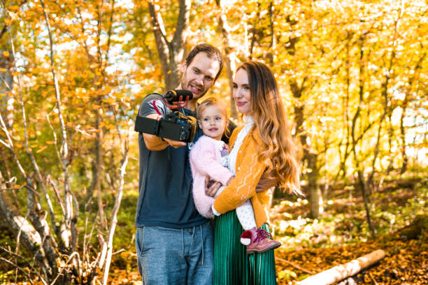 istock Family vlogging outdoors in autumn 866530030