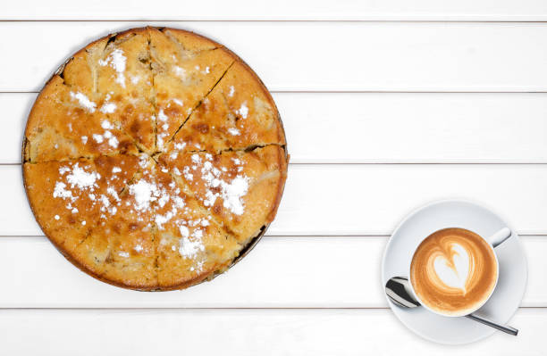 istock Cake pie with apples cup of coffee 866534046