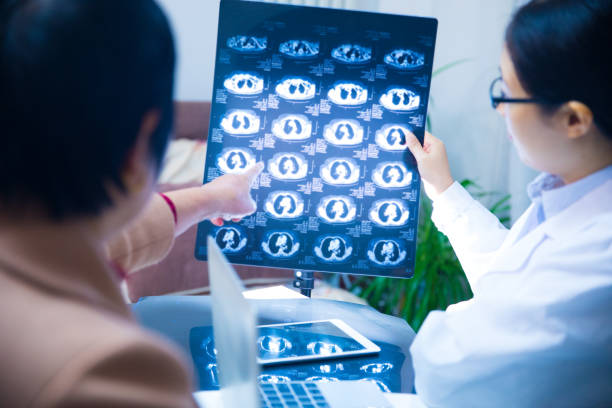 istock Female doctor discussing MRI with patient 866535124