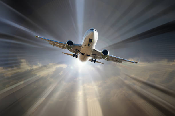 istock Airplane taking up on sunbeams background 866538276