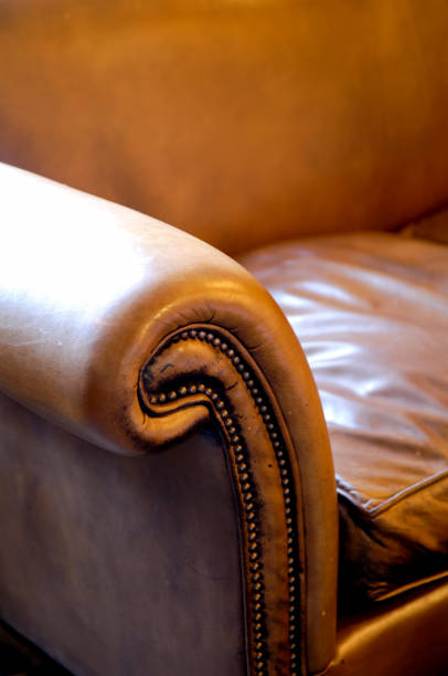 istock Ornate Armrest of a Vintage Leather Couch 866538848