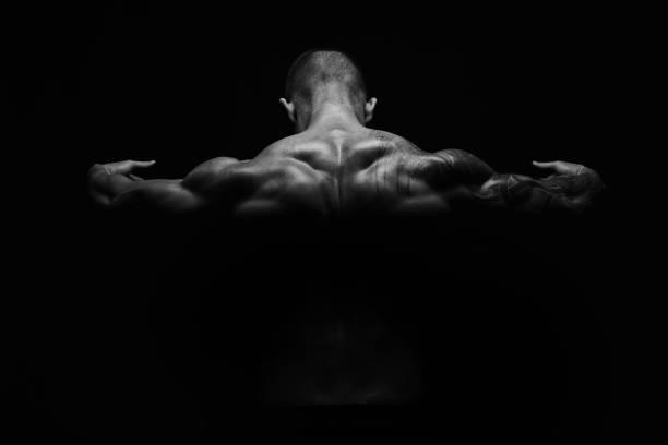 istock Unrecognizable man shows strong back muscles closeup 866539480