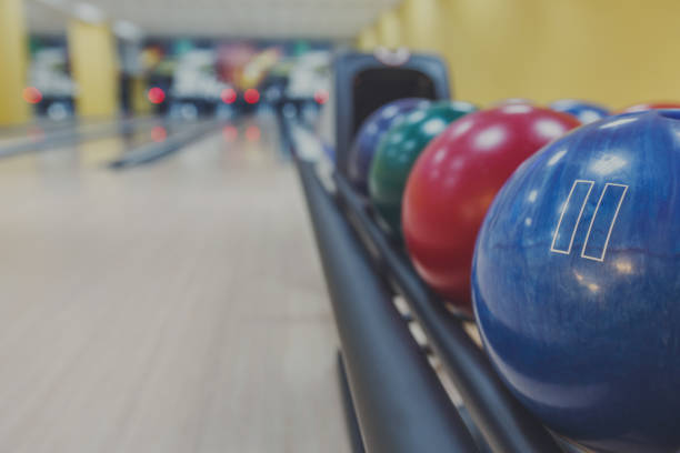 istock Bowling balls return machine, alley background 866540092