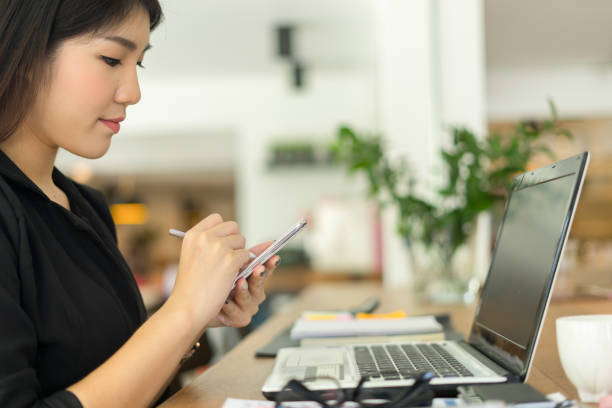 istock modern business woman working with smartphone in office 866544158