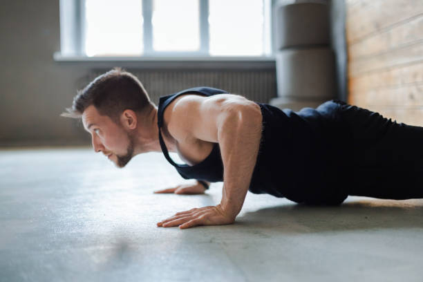 istock Young man fitness workout, push ups or plank 866547754