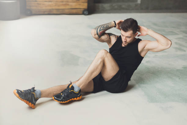 istock Young man fitness workout, cross crunches for abs 866548358