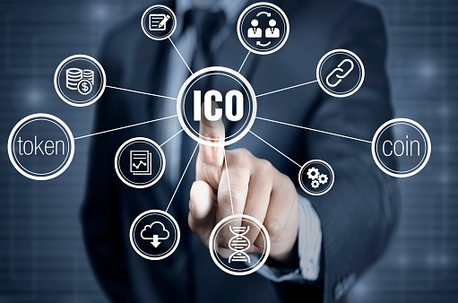 Finger pointing into the ico - initial coin offering