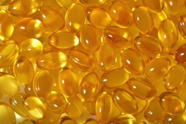 istock Omega-3 fish fat oil capsules as background 866557044