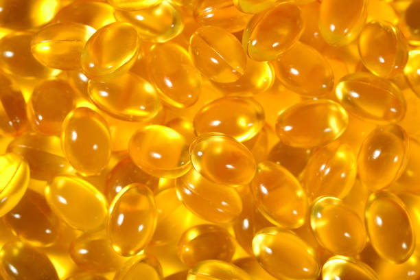 istock Omega-3 fish fat oil capsules as background texture 866562982