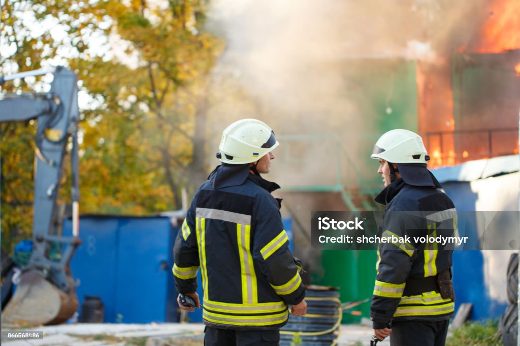 2 Firefighters Ric Two Firefighters On A Fire On The Background Fire Stock Photo ...
