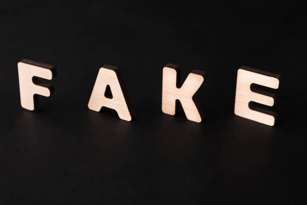 istock Word Fake on black background 866571204