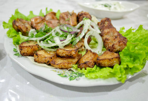 istock Barbecue beef with onion and salad on the plate 866571358