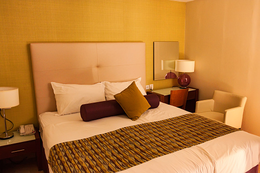 Closeup picture of double bed in hotel room