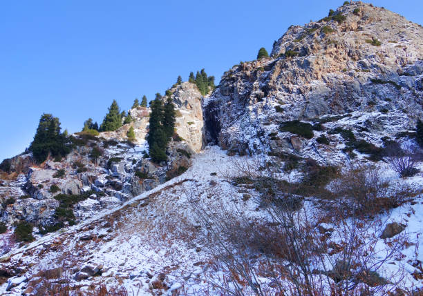 istock Zaili Alatau shadowed mountains against blind blue sky in winter. 866575996