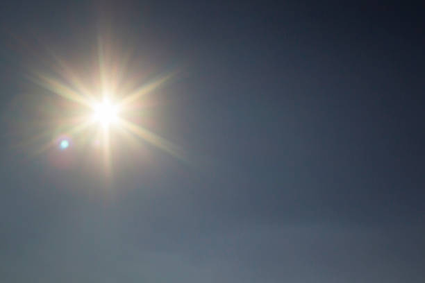 istock sun on clear blue sky weather background 866578876