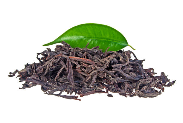 istock Heap of dry tea with green tea leaf on a white background 866583148