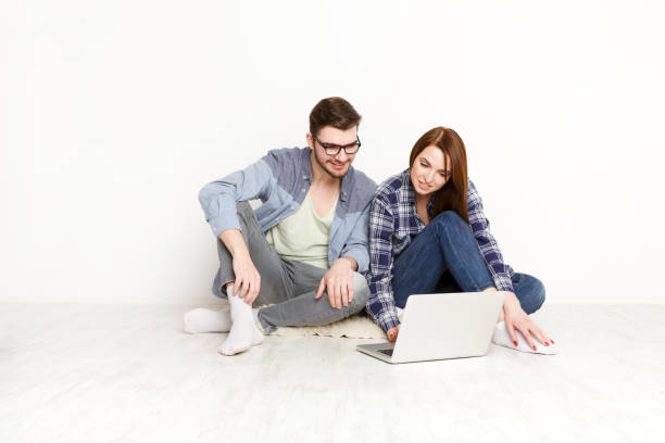 istock Couple planning design project for new apartment 866583918