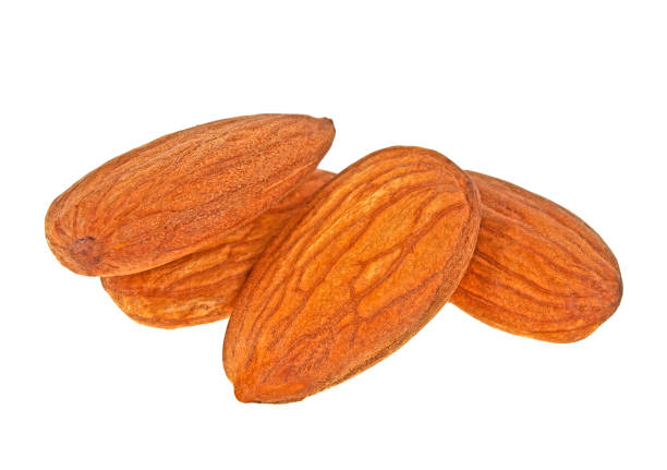 istock Group of almonds isolated on white background 866584236