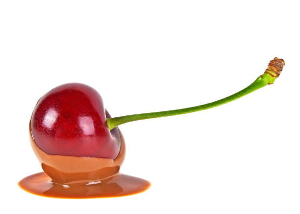 istock Cherry in hot chocolate on a white background 866584334