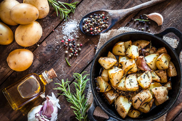 istock Roasted potatoes on wooden kitchen table 866584832