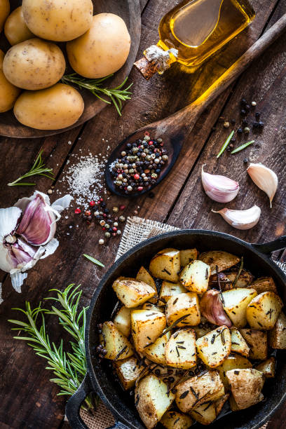 istock Roasted potatoes on wooden kitchen table 866584834