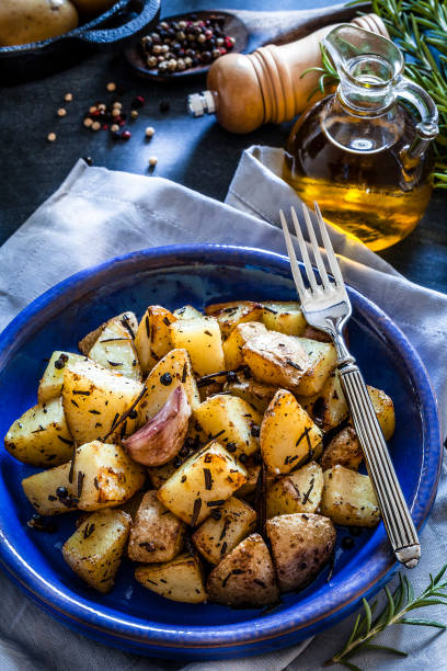 istock Roasted potatoes in a blue plate 866585192