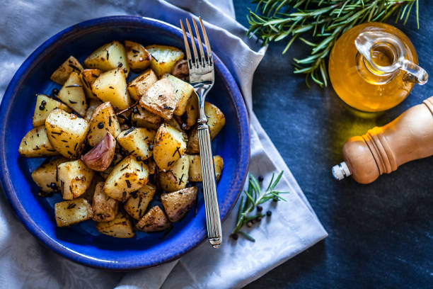 istock Roasted potatoes in a blue plate 866585230