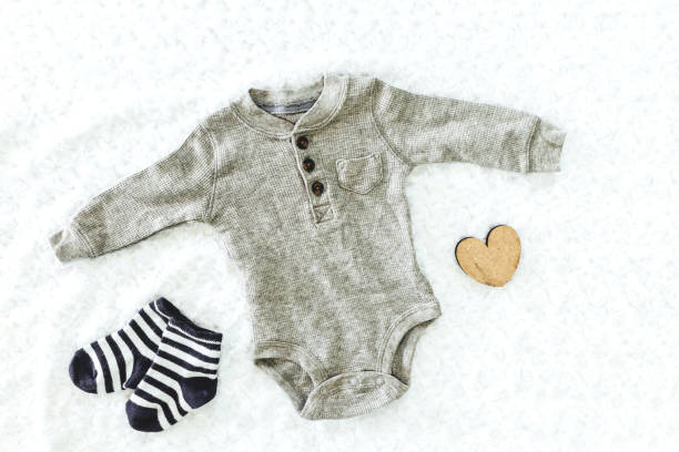 istock Clothes for baby on the bed 866588120