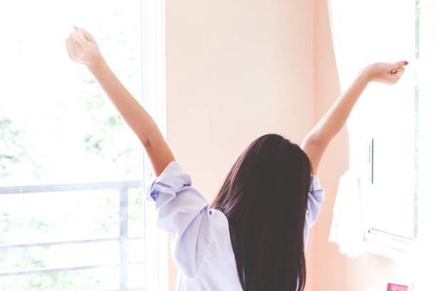 istock Woman stretching in bed after wake up 866588704