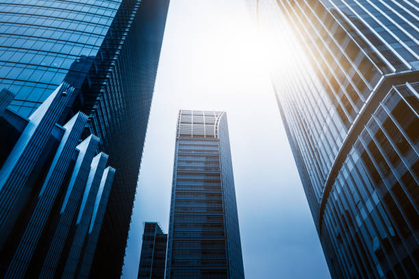istock modern office buildings against sky 866592850