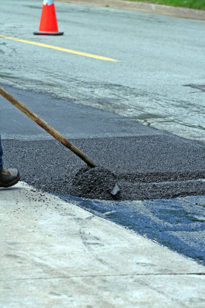 istock Raking Hot Asphalt On Road Repair Site 866601536