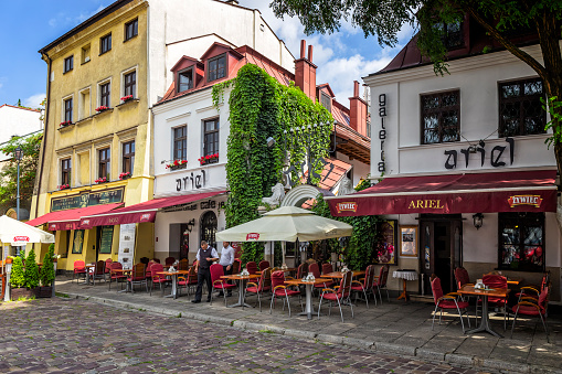 Krakow, Poland - August 23,2017:Jewish restaurant and cafe pub on Szeroka street in Kazimierz district in Krakow, Poland. Krakow is the second largest and one of the oldest cities in Poland