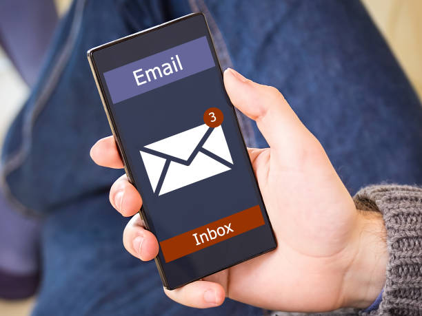 istock The man received an email online on a mobile phone. E-mail message icon. 866608374