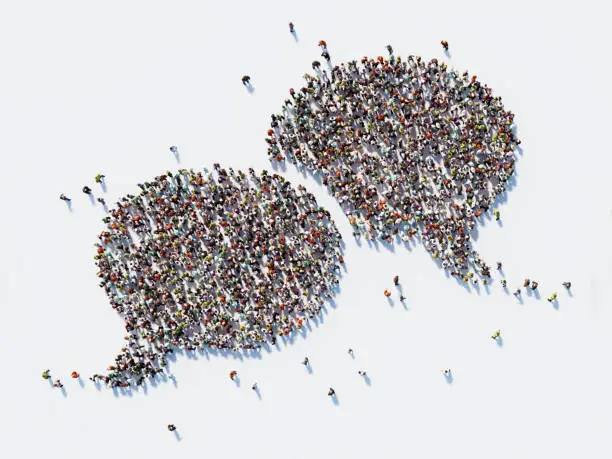 Photo of Human Crowd Forming A Big Speech Bubble: Communication And Social Media Concept