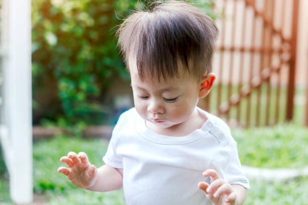 istock Asian baby boy look somewhere in the park 866608724