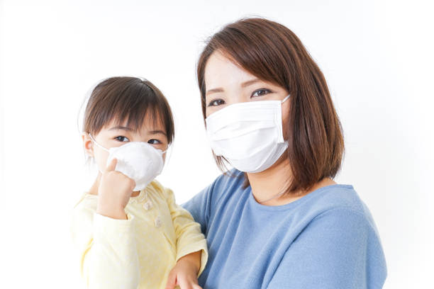 istock Mother and baby with cold prophylaxis mask 866609320