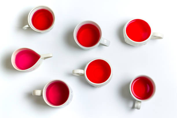 istock Red herbal tea in cups on white background 866609688