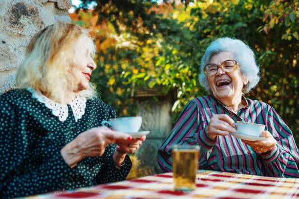 istock Senior women drinking coffee and laughing 866616096