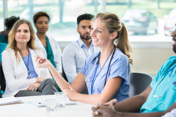 istock Nurse participates in panel discussion during medical conference 866617144