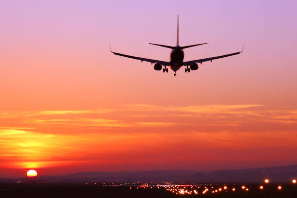 istock The plane lands at dusk at sunset 866617194
