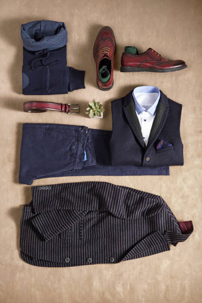 istock Men's clothes isolated on belge background 866617492