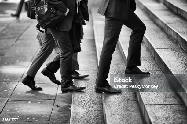 Group Of Businessmen Walking Outdoors Stock Photo - Download Image Now - Men, Dress Shoe, Stepping