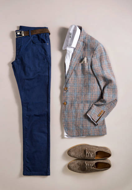 istock Men's clothes isolated on beige background 866618622