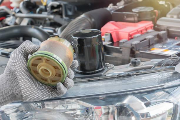 istock Auto mechanic with dirty hands and oil filter. Service maintenance. 866625062