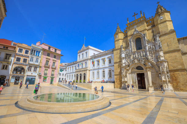 Old Coimbra Town Coimbra, Portugal - August 14, 2017: people in historic square with popular Santa Cruz Monastery and Church and Town Hall. Sunny day with blue sky. Old Coimbra town in Central Portugal, Europe. coimbra city stock pictures, royalty-free photos & images