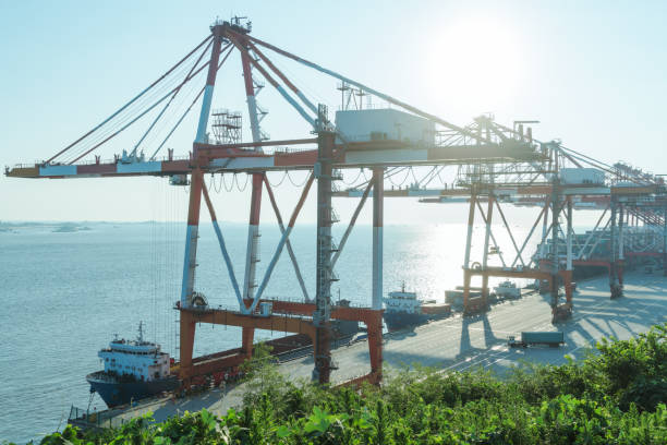 istock row of giant cranes at freight terminal 866635652